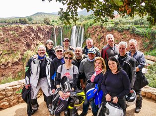 Motorcycle group in front of the waterfalls of ouzoud