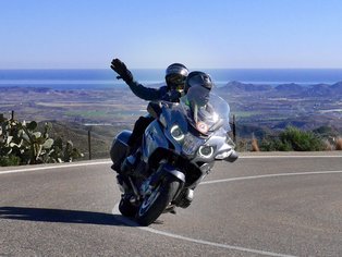 Motorcyclist and passenger in Spain